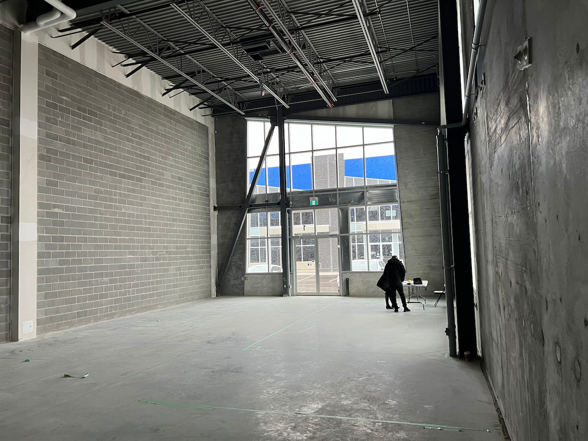 Empty warehouse unit with clerestory windows – Aurora