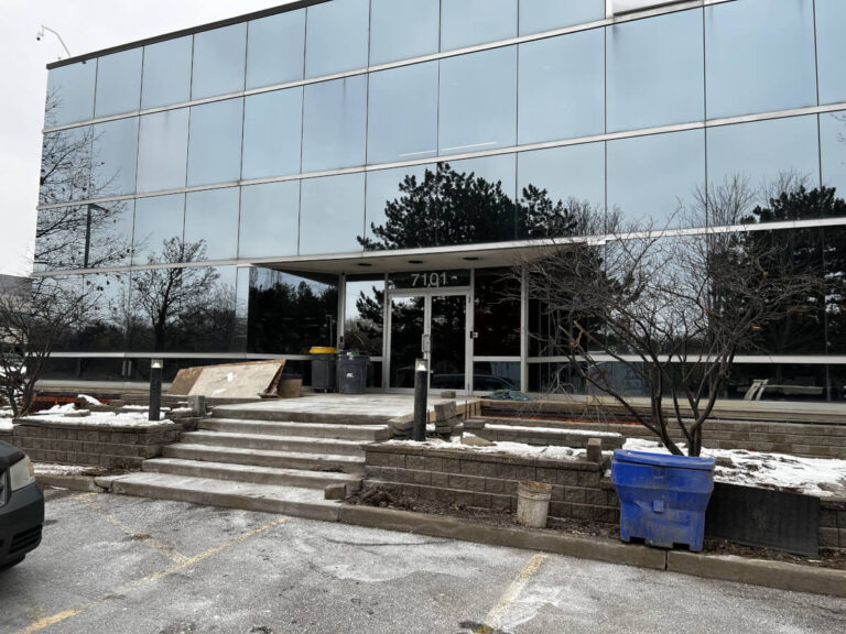 Existing commercial office building entrance before entrance canopy renovation in Mississauga