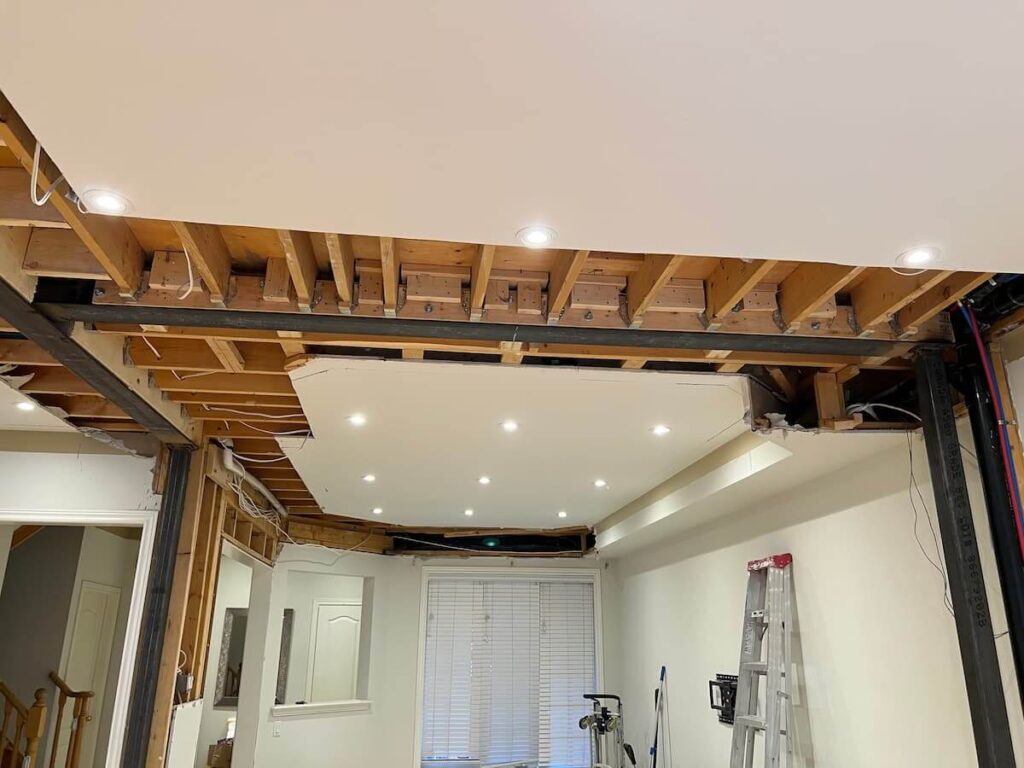 Interior wall removal project with exposed structural steel beams during renovation in Richmond Hill ON