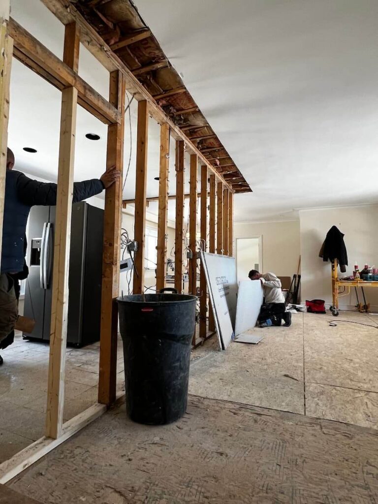 Residential wall removal project during demolition and structural preparation phase